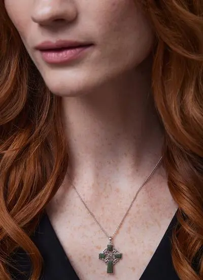 Close up of red haired model wearing Sterling Silver Connemara Marble Celtic Cross Pendant